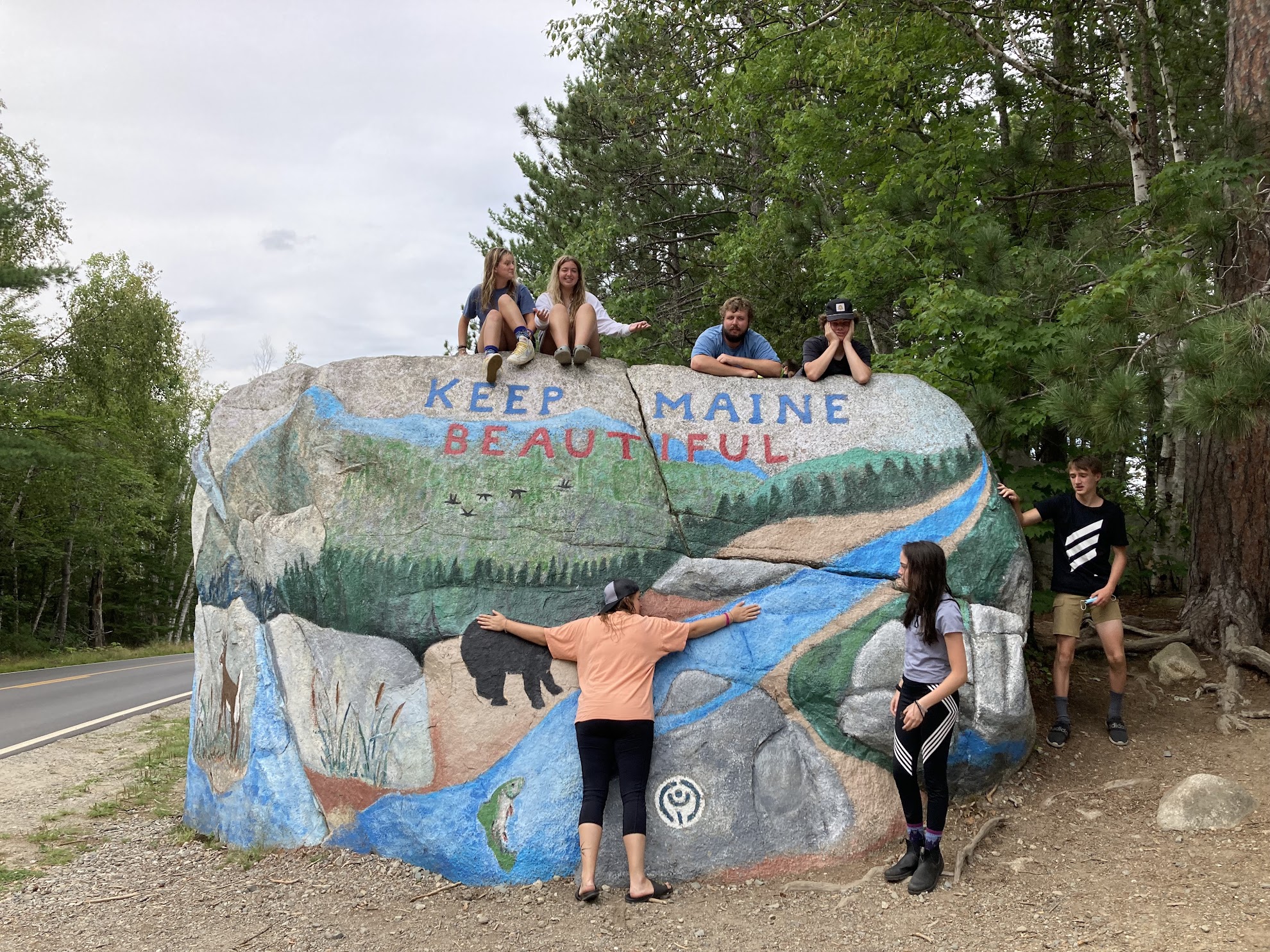 Program Manager Katlyn hugs the Keep Maine Beautiful Rock