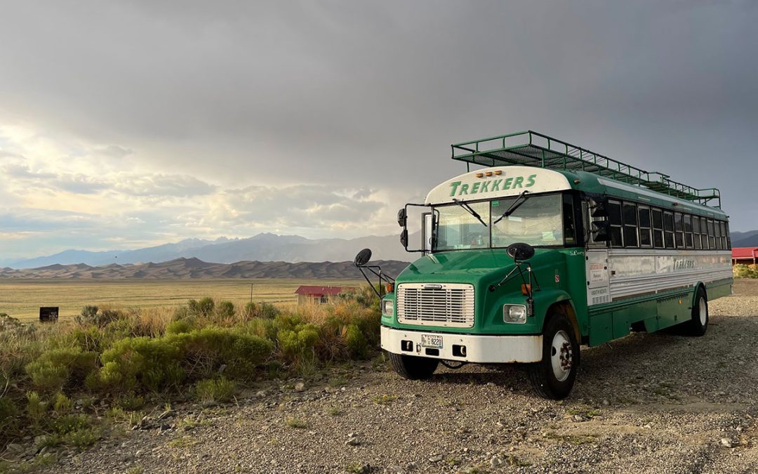 bus against a horizon in the desert background