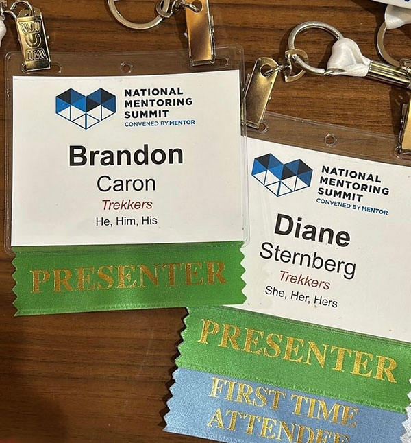 Photos of Brandon and Diane's Presenter lanyards at the conference