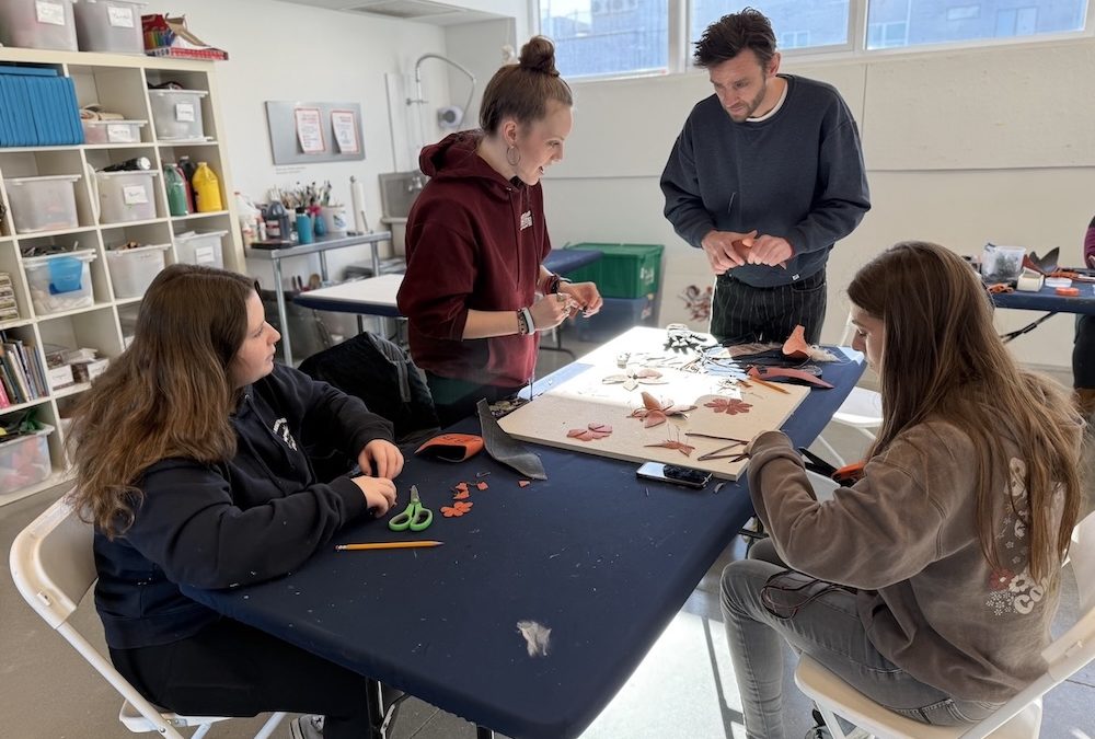 Students and artist talking